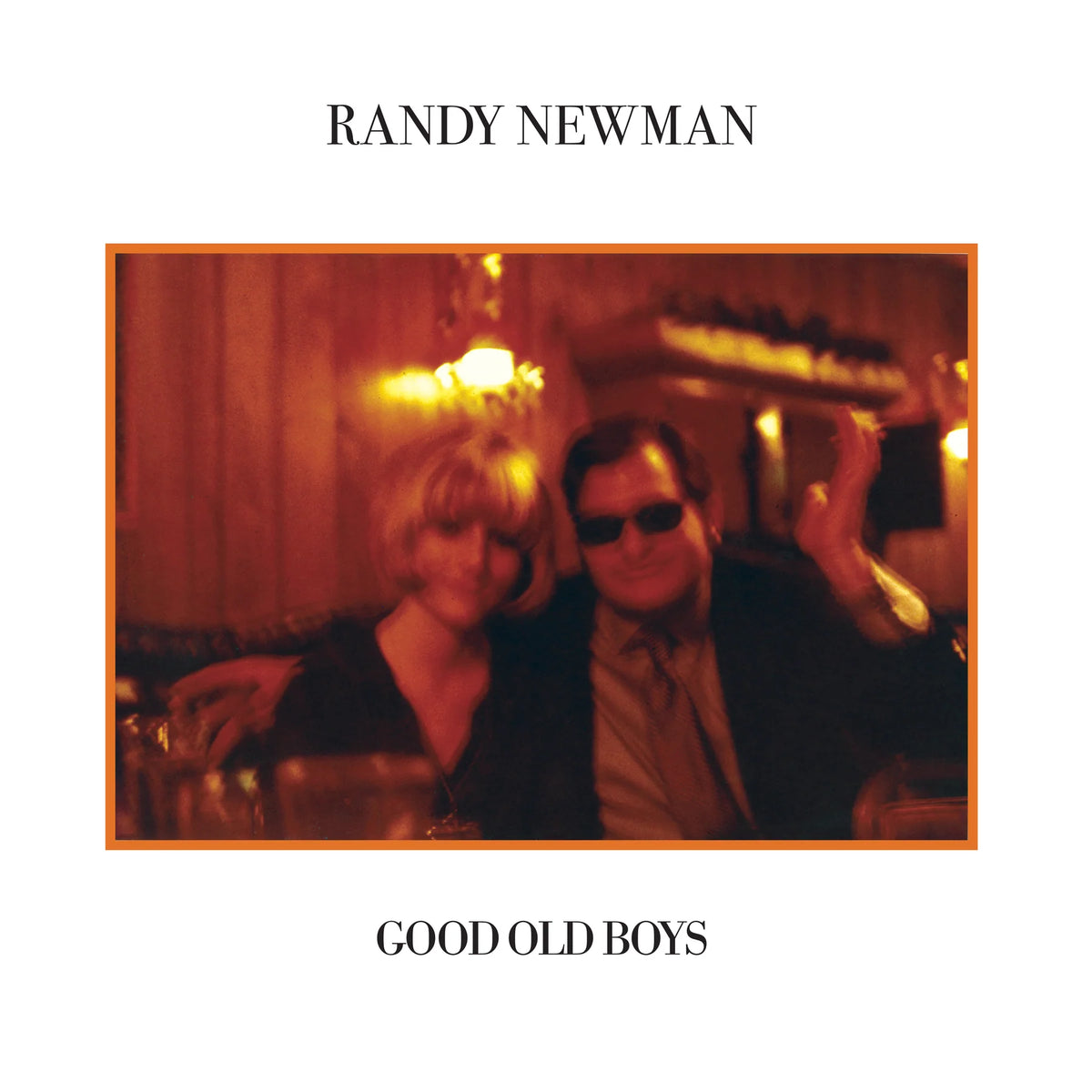 Randy Newman's 'Good Old Boys' album cover, featuring a central square photograph of a man and woman in a dimly lit bar with warm orange lighting, framed by a white border with black text.