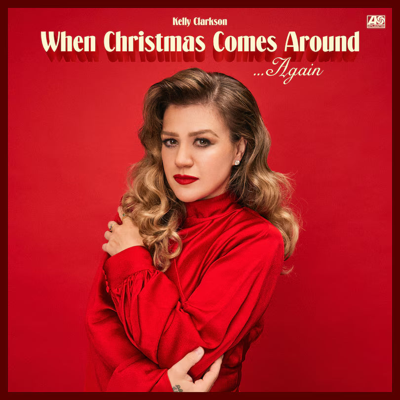 Album cover with a woman in a red dress against a red background, featuring text about Christmas music.
