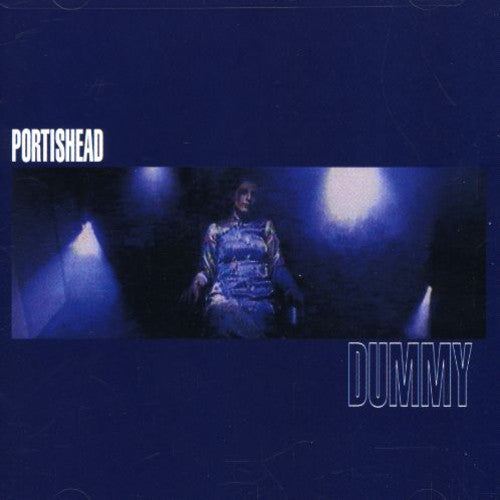 Album cover for Portishead's 'Dummy' with a person sitting in a dimly lit room.
