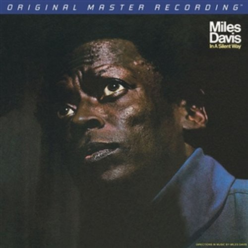 Album cover featuring a close-up of a person with text about Miles Davis' 'In A Silent Way'.