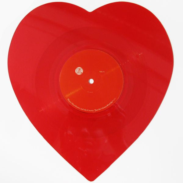 A red heart-shaped vinyl record.