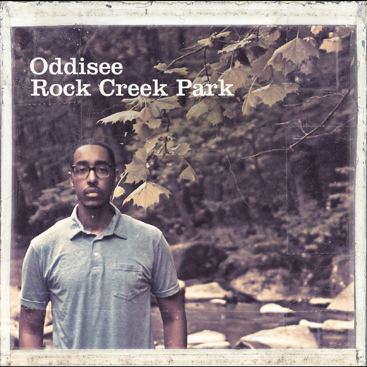 Person standing in a forest with 'Oddisee Rock Creek Park' text overlay