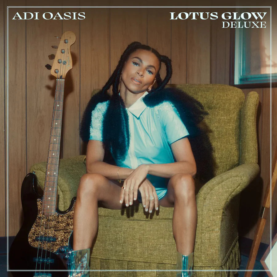 Person sitting on a green chair with a guitar, album cover for 'Lotus Glow Deluxe' by Adi Oasis.