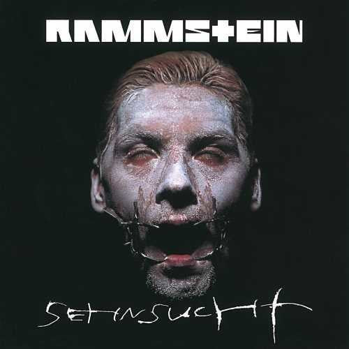 Album cover for Rammstein's 'Set It Off' with a person with white makeup and black face paint.