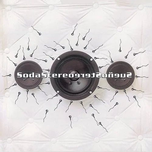 Three black car audio speakers arranged horizontally on a white quilted background, with a stylized text overlay reading 'SodaStereo' across the center.