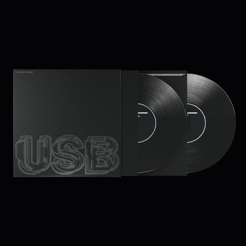 A vinyl record titled 'USB' by Fred Again, displayed in a sleeve with a reflective surface and a visible needle.