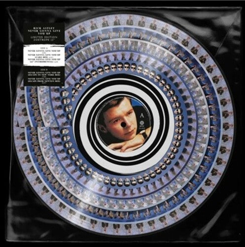 Vinyl record with spiral design and portrait, surrounded by packaging