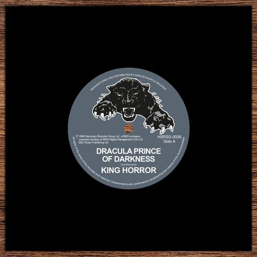Vinyl record label with a bear illustration and text on a black background