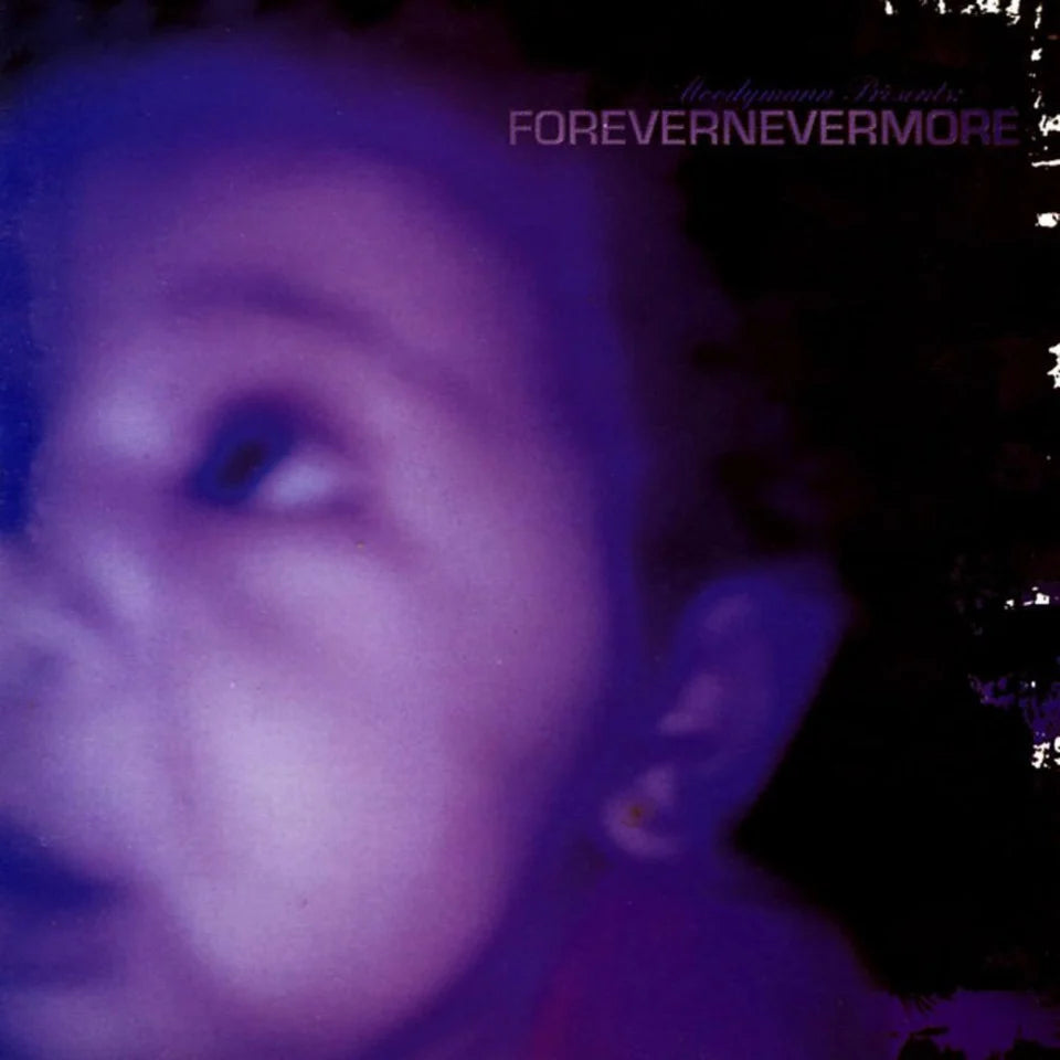Close-up of a person with text 'FOREVERNEVERMORE' in the background
