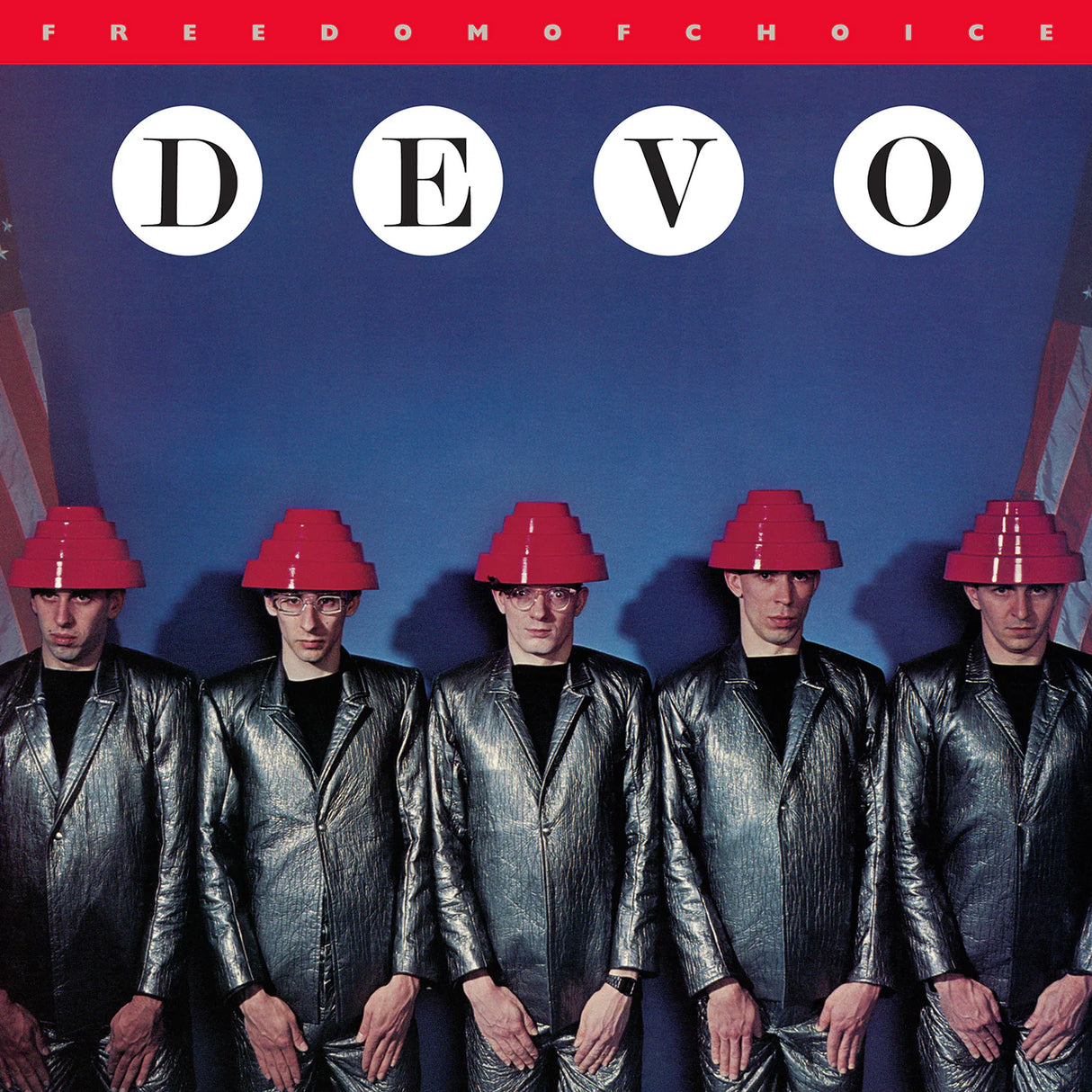 Album cover of DEVO with band members wearing red hats and shiny suits against a blue background.