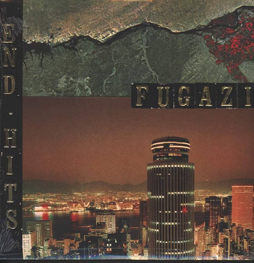 Album cover with cityscape, mountain, and text 'Fugazi' at the top.