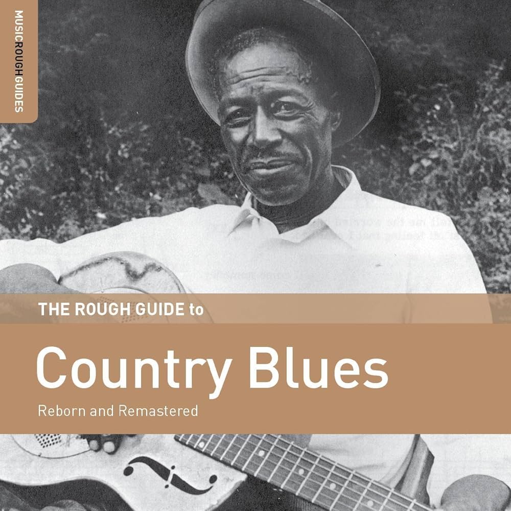 Album cover for 'The Rough Guide to Country Blues' featuring a black and white photo of a man with a guitar.