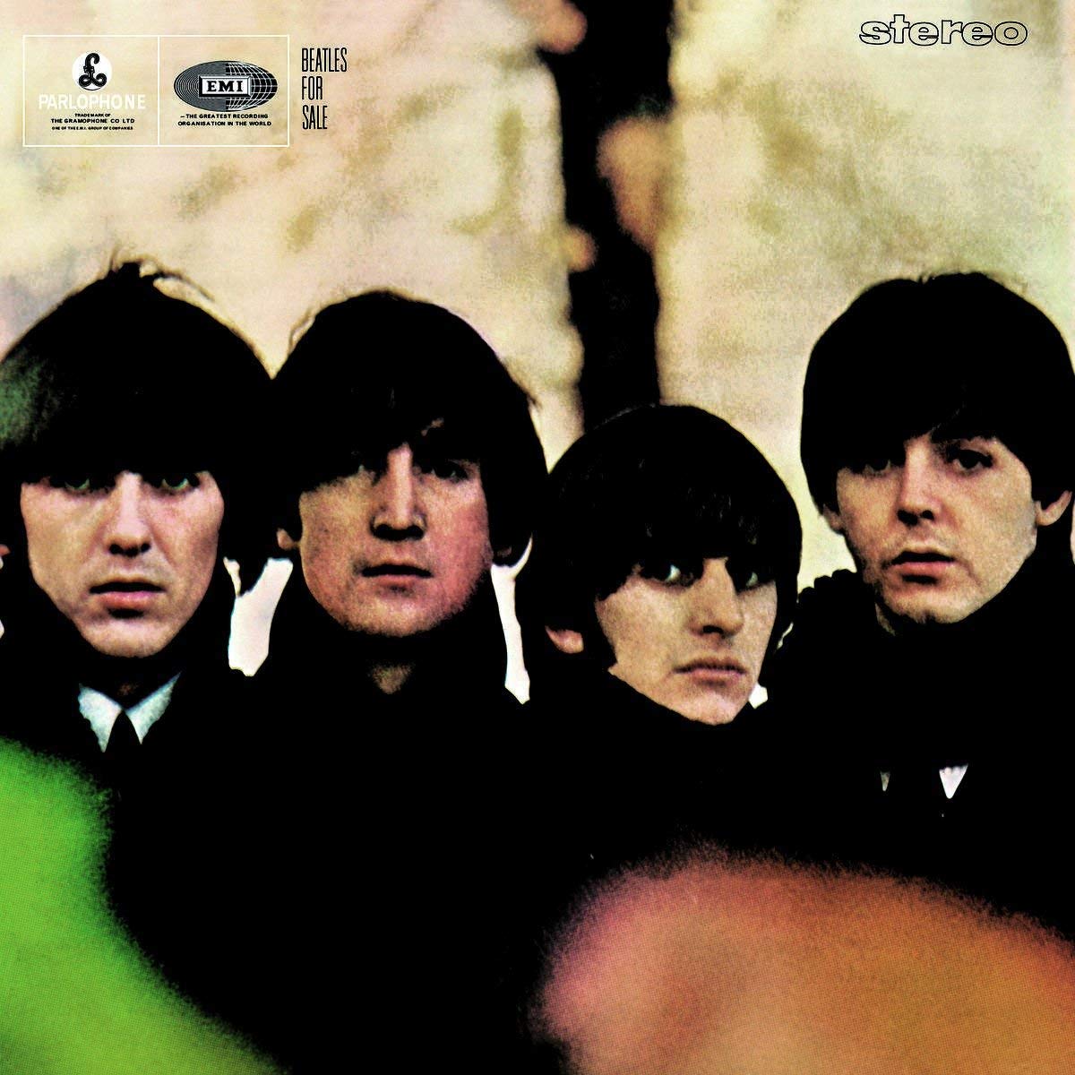 Album cover featuring four band members with a textured background