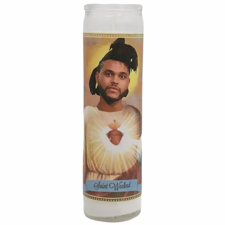 Candle with a portrait of a person labeled 'Saint Weeknd' on a white background