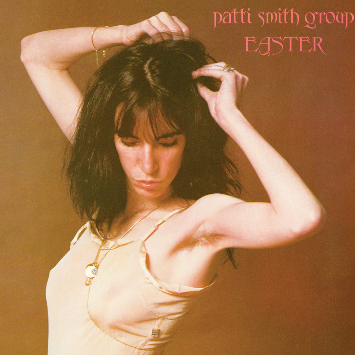 Patti Smith album cover for 'Easter' featuring a photograph of Patti Smith with her hands in her hair, wearing a sleeveless top, against a plain background.