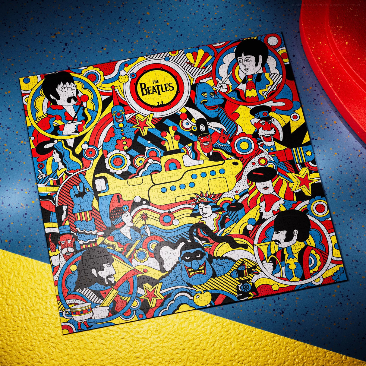 Colorful album cover with The Beatles' artwork on a blue and yellow textured surface