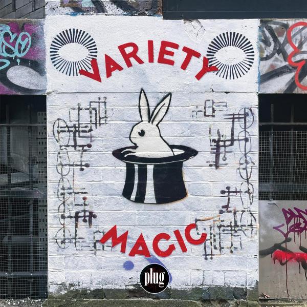 Graffiti art on a wall with 'VARIETY MAGIC' and a rabbit in a hat design.