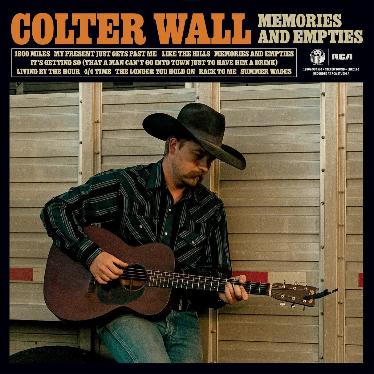 Album cover featuring a person playing guitar with text 'Colter Wall Memories and Empties' at the top.