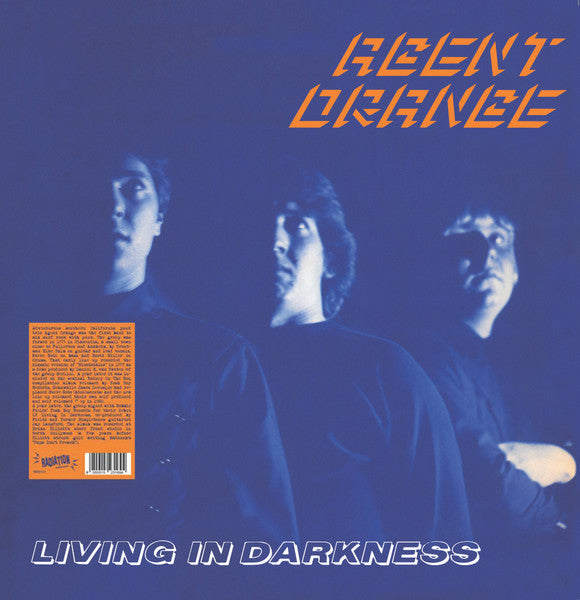 Album cover for Agent Orange - Living In Darkness LP featuring three members of the band with a blue and orange text on a dark background.