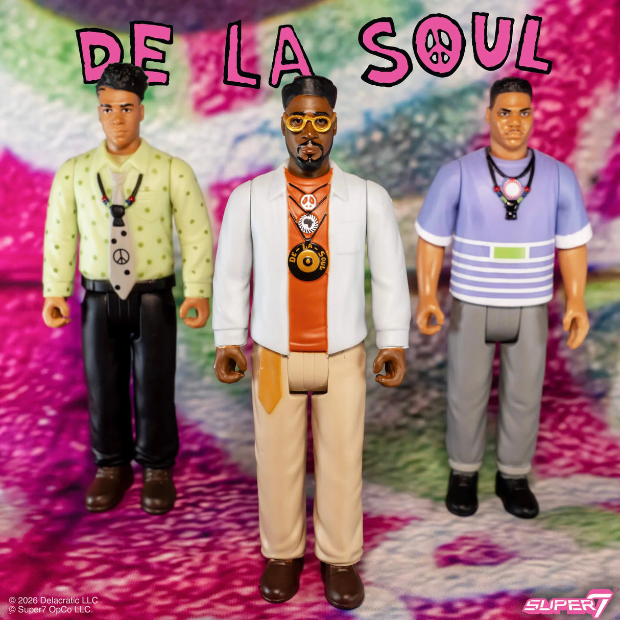 Three action figures of De La Soul members on a colorful background with 'De La Soul' text above.