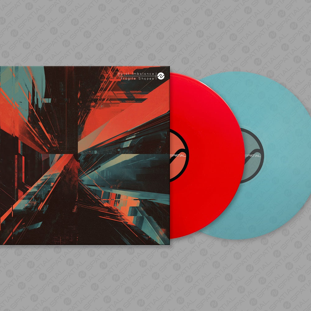 Vinyl record with a colorful cover on a gray textured background