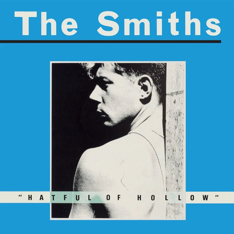 Album cover for 'The Smiths' with a blue background and black and white photo of a person.