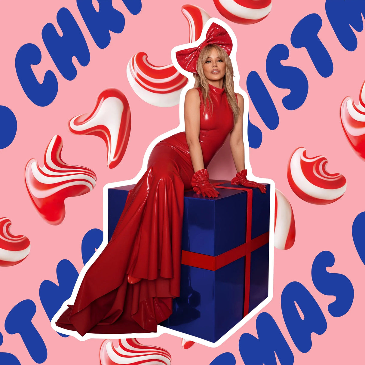 Woman in a red dress sitting on a blue gift box with Christmas-themed background