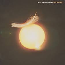 Album cover with a feather and sun design, featuring the text 'Great Lake Swimmers' and 'Current Light'.