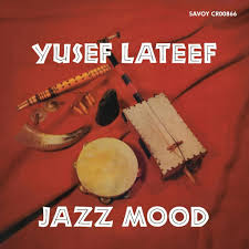 Album cover for 'Jazz Mood' by Yusef Lateef with musical instruments on a red background.
