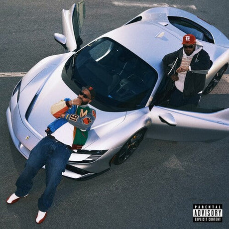 Two people interacting with a futuristic vehicle on a road, with a 'Parental Advisory' label indicating explicit content.