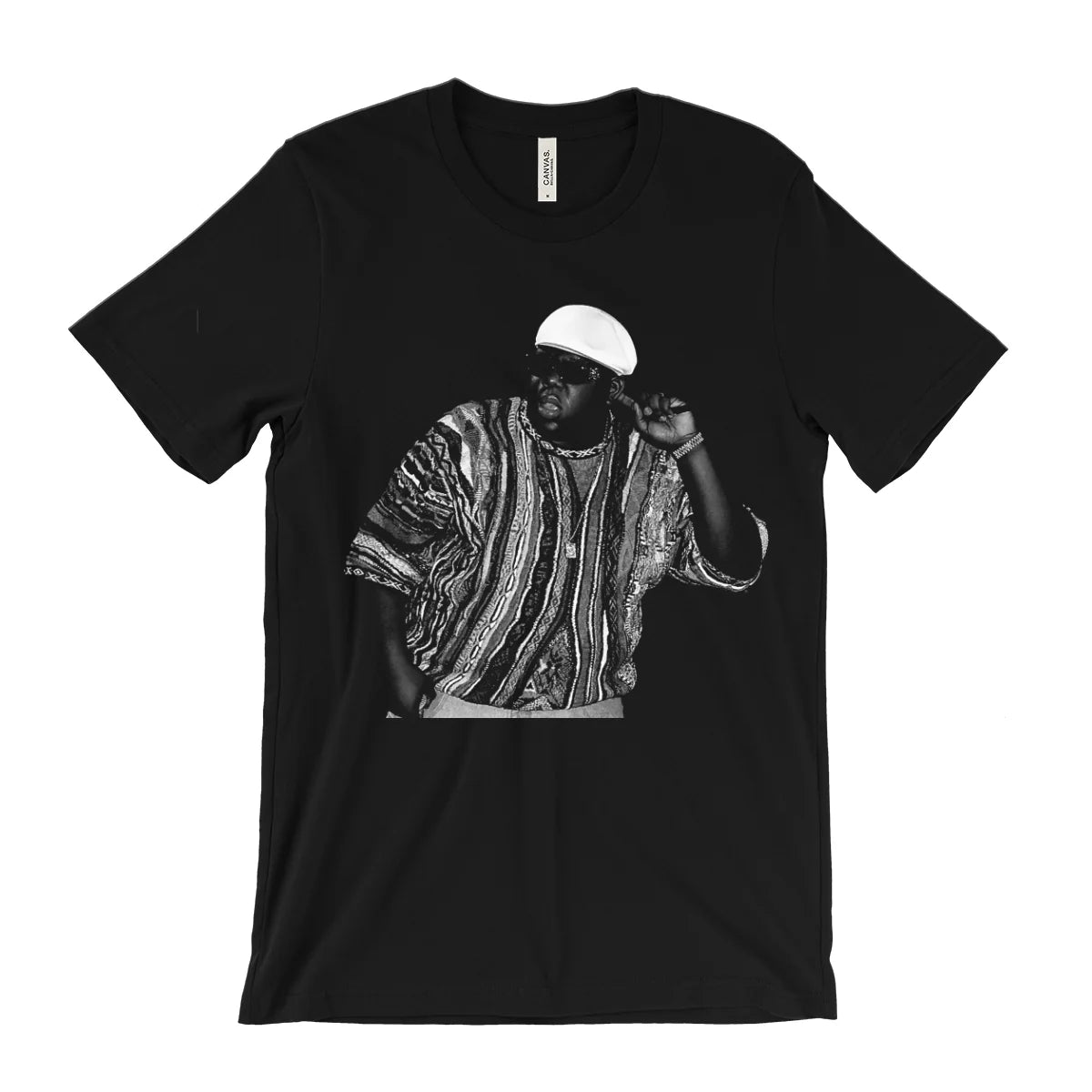A black short-sleeve crewneck t-shirt featuring a black and white graphic print of a man in a patterned shirt and white cap, displayed flat against a white background.