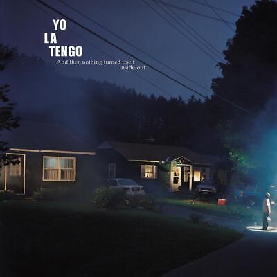 Album cover featuring a residential house at night with a title 'YO LA TENGO' written above and the album title 'And then nothing turned it’self inside-out' below.