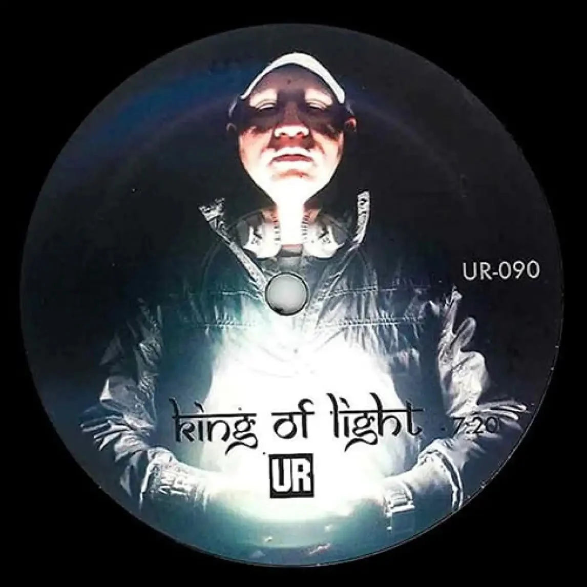 Vinyl record with a person wearing a hood and text 'king of light' and 'UR' on a dark background