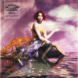 Album cover featuring a person with red hair sitting in a vibrant, purple environment that resembles a stylized version of the ocean with sequined fabric.