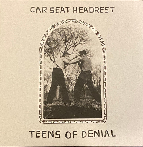 Album cover for Car Seat Headrest's 'Teens of Denial' featuring a black and white photograph of a person cutting down a tree with a axe, framed within an arched doorway.