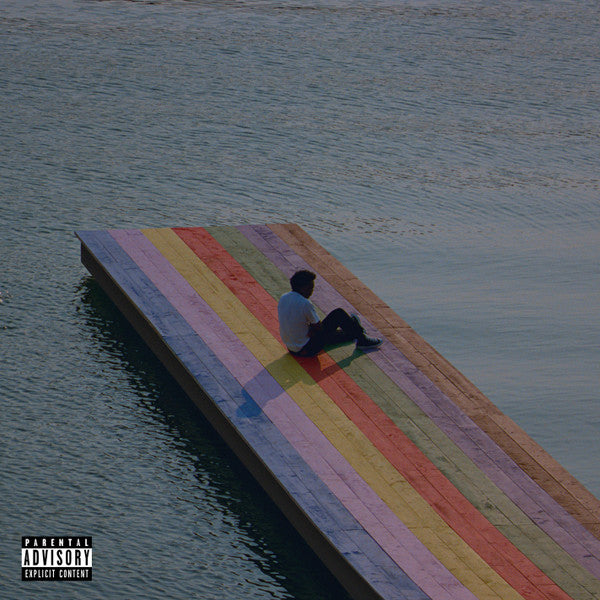 An album cover featuring a colorful, multilevel dock extending into calm water, with a person seated on the dock looking towards the camera.