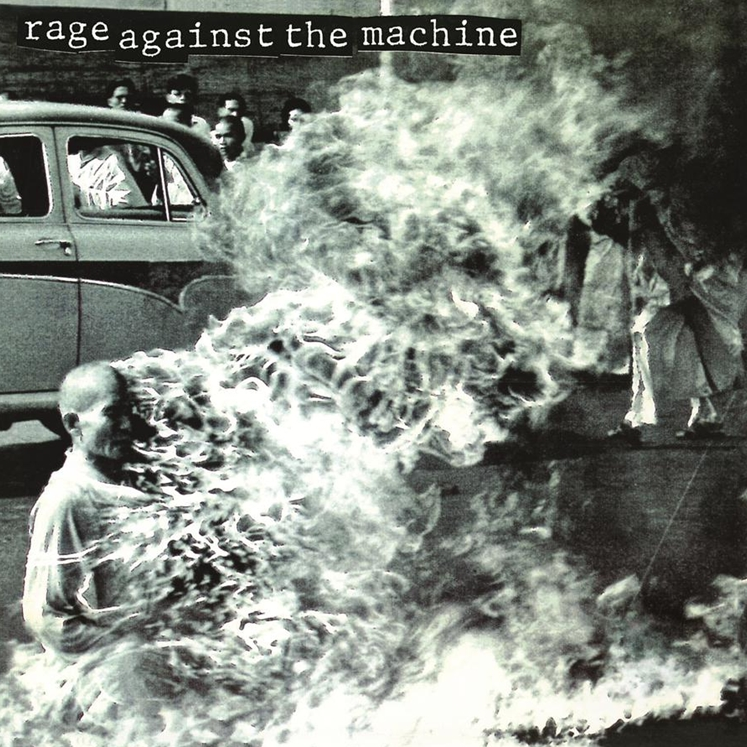 Album cover for Rage Against The Machine featuring a black and white image with a person sitting in front of a car, surrounded by smoke or steam.