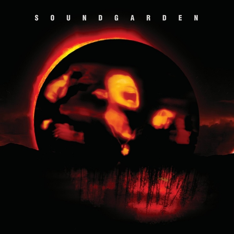 Album cover for Soundgarden's Superunknown with a stylized image of a setting sun over a silhouette of a city.