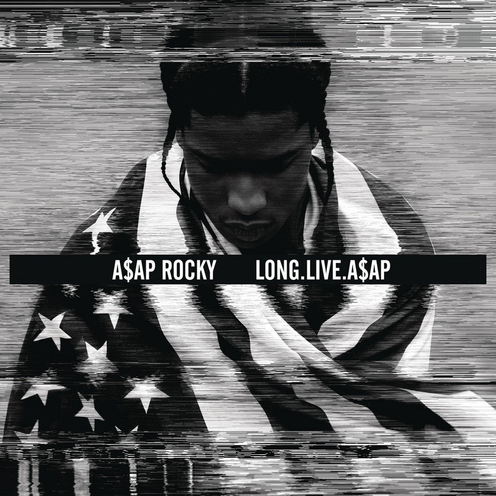 A black and white album cover featuring a person wrapped in an American flag with the text 'A$AP ROCKY LONG.LIVE.