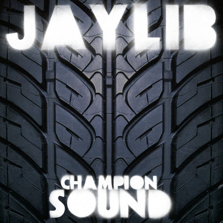 Album cover for Jaylib - Champion Sound featuring a close-up of a tire track with the artist names 'JAYLIB' and 'CHAMPION SOUND' prominently displayed.