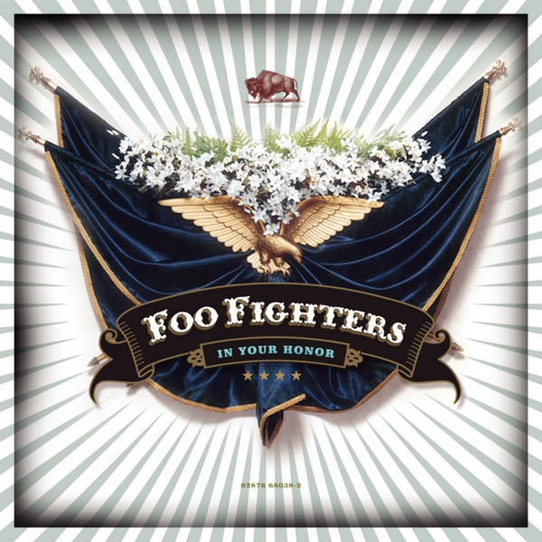 Foo Fighters album cover for 'In Your Honor' featuring a graphic design with an eagle, flowers, and the band's name.
