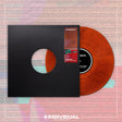 Vinyl record with orange disc and black cover on a colorful background