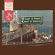 Album cover with a road sign and bridge, featuring a red label on the top left corner.