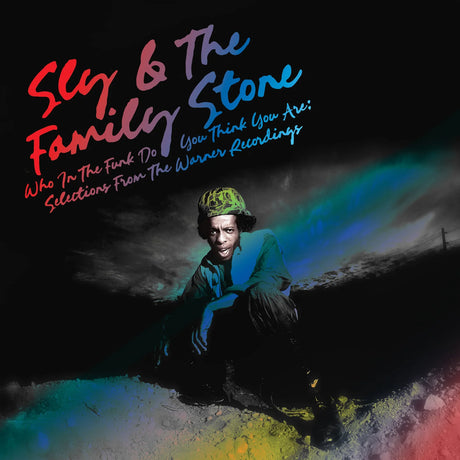 Album cover with text 'Sly & The Family Stone' and a person sitting on a colorful, abstract background.