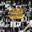 Album cover for 'Snakes and Ladders' by Faces featuring a collage of black and white photos and colorful text.