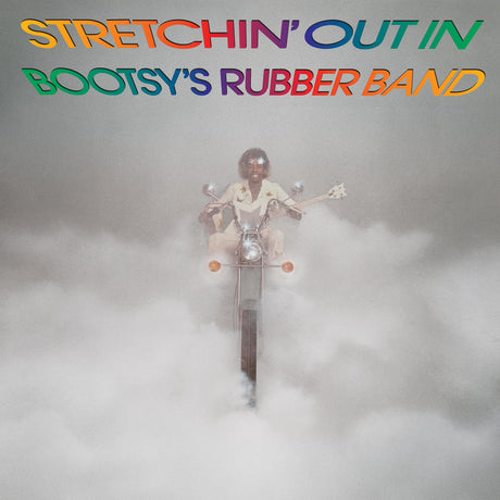 Album cover art for 'Stretchin' Out In Bootsy's Rubber Band' featuring a surreal scene of a person riding a motorcycle through thick white fog, with the colorful album title text at the top.