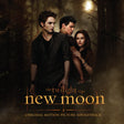 Promotional poster for 'The Twilight Saga: New Moon' with three characters in a forest setting.