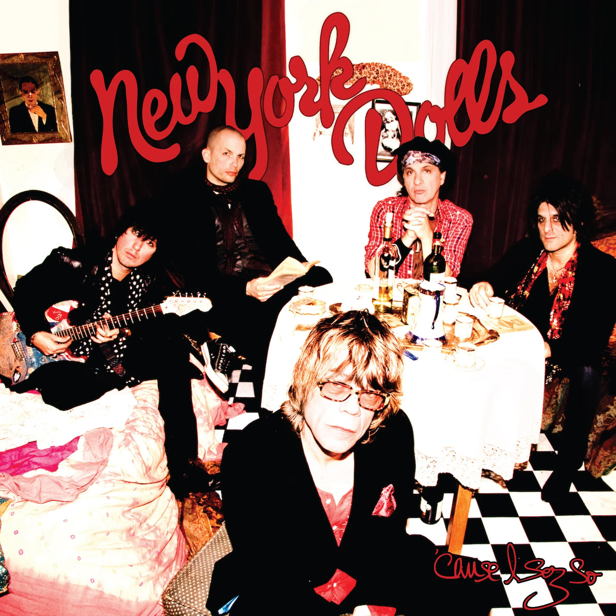 Album cover featuring a band with 'New York Dolls' text in a vintage setting.