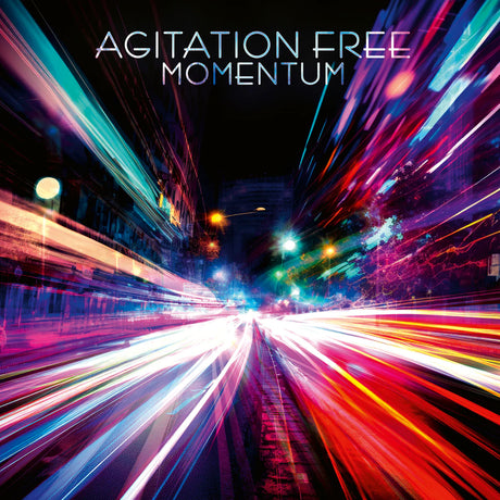 Album cover with 'Agitation Free Momentum' text over a dynamic city street scene.
