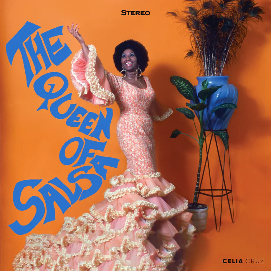 Album cover for 'The Queen of Salsa' featuring a woman in a pink dress against an orange background.